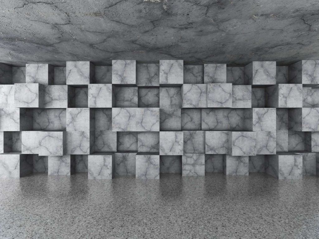 Betonnen ruimte met kubussen tegen de muur