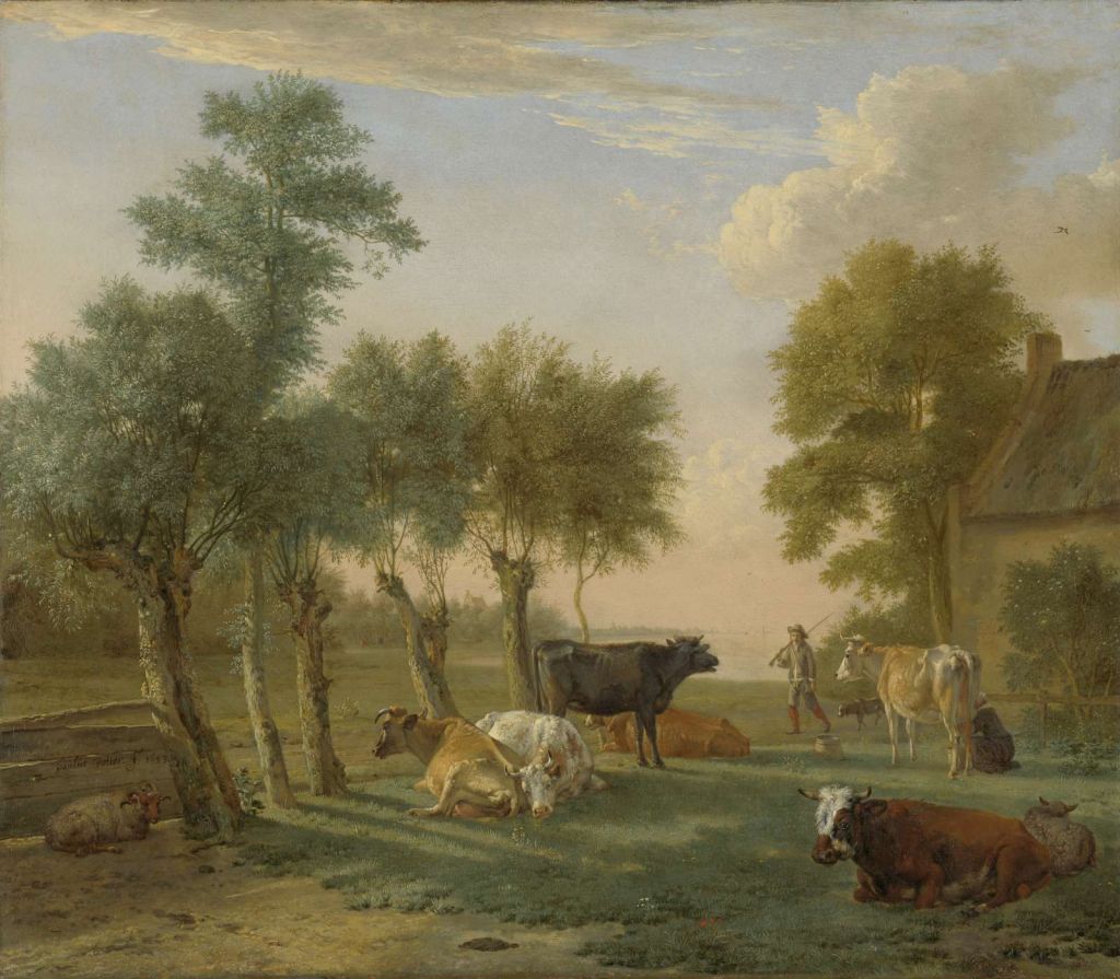Koeien in de wei bij een boerderij