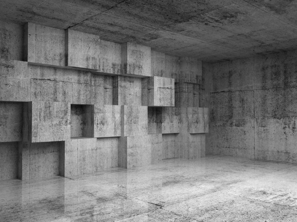 Lege betonnen interieur met decoratie kubussen op de muur