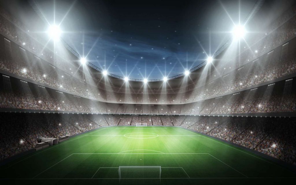 Verlicht voetbalstadion met sterrenhemel