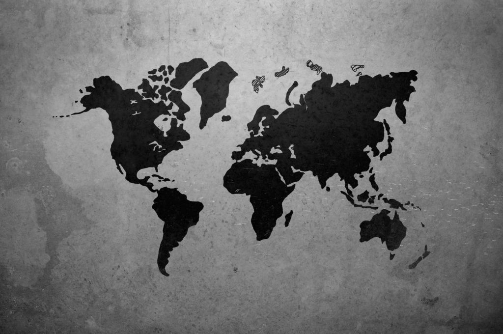 Zwarte wereldkaart op een betonnen muur