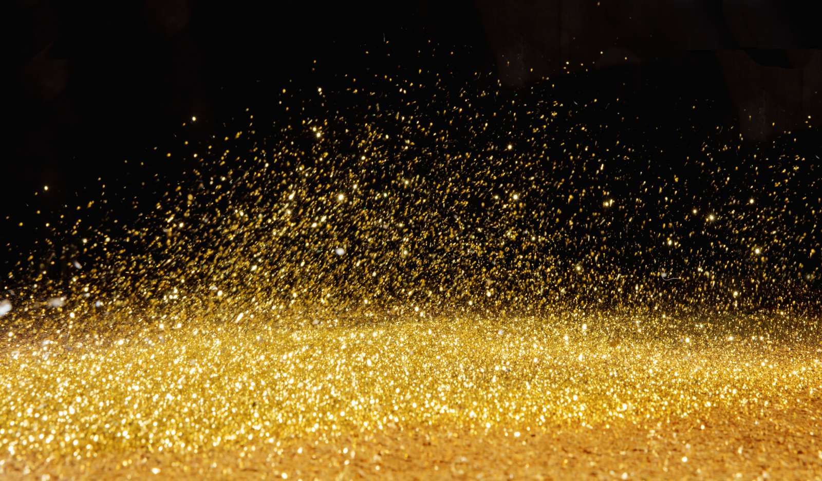 Gouden glitters met een zwarte achtergrond