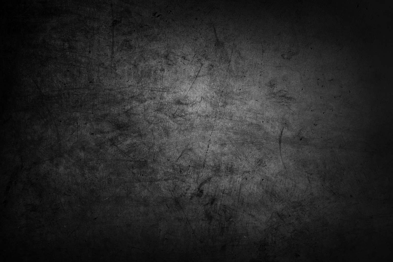 Grijze muur met krassen